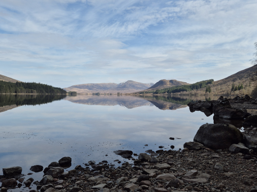 Loch Ossian and Rannoch Moor, Scotland, reflected in calm water
